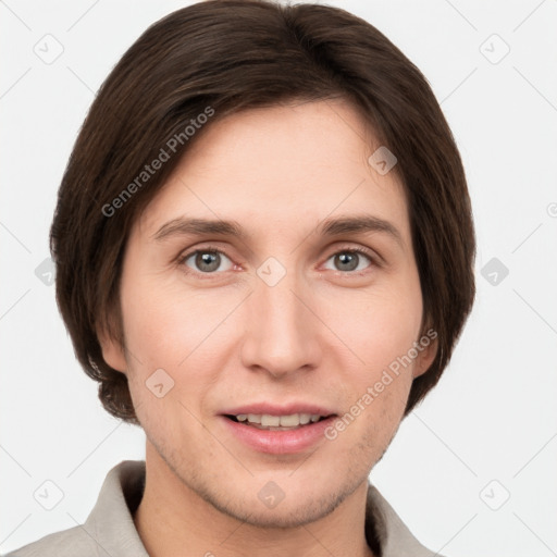 Joyful white young-adult female with short  brown hair and grey eyes