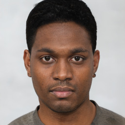 Neutral black young-adult male with short  black hair and brown eyes