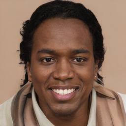 Joyful black young-adult male with short  brown hair and brown eyes