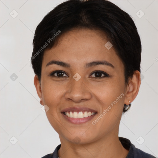 Joyful asian young-adult female with short  black hair and brown eyes