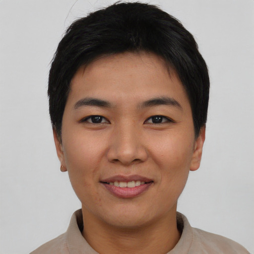Joyful asian young-adult female with short  black hair and brown eyes