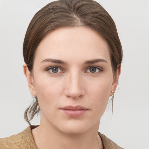 Neutral white young-adult female with short  brown hair and grey eyes