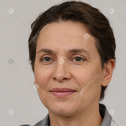 Joyful white adult female with short  brown hair and brown eyes