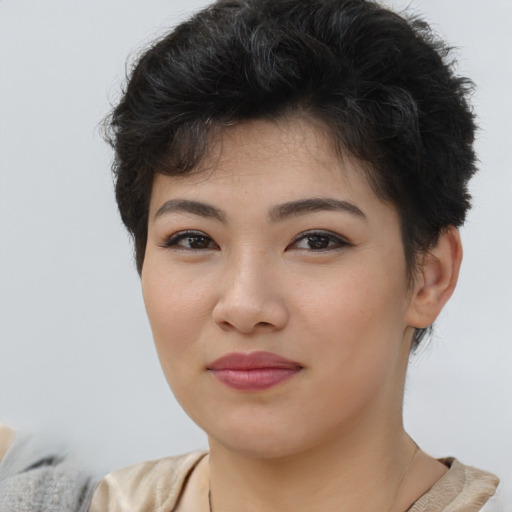 Joyful asian young-adult female with short  brown hair and brown eyes