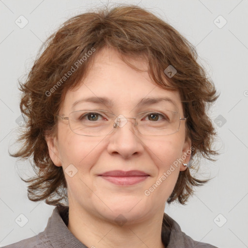 Joyful white adult female with medium  brown hair and brown eyes