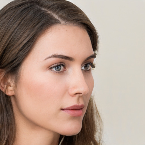 Neutral white young-adult female with long  brown hair and grey eyes