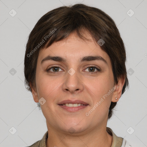 Joyful white young-adult female with medium  brown hair and grey eyes