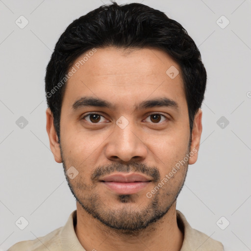 Joyful latino young-adult male with short  black hair and brown eyes