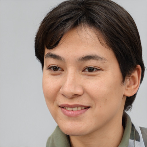 Joyful asian young-adult female with medium  brown hair and brown eyes