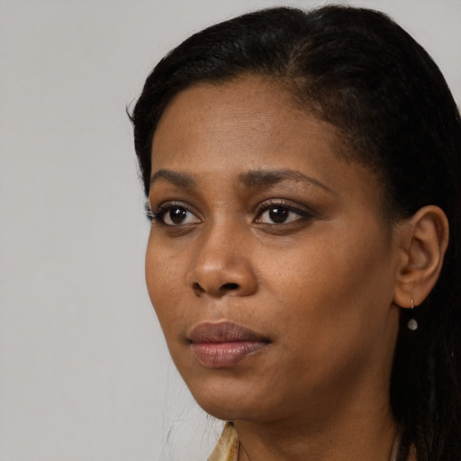 Neutral black young-adult female with short  black hair and brown eyes