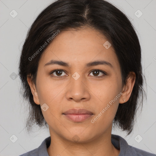 Joyful latino young-adult female with medium  brown hair and brown eyes