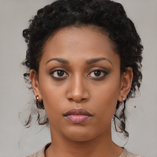 Neutral black young-adult female with short  brown hair and brown eyes