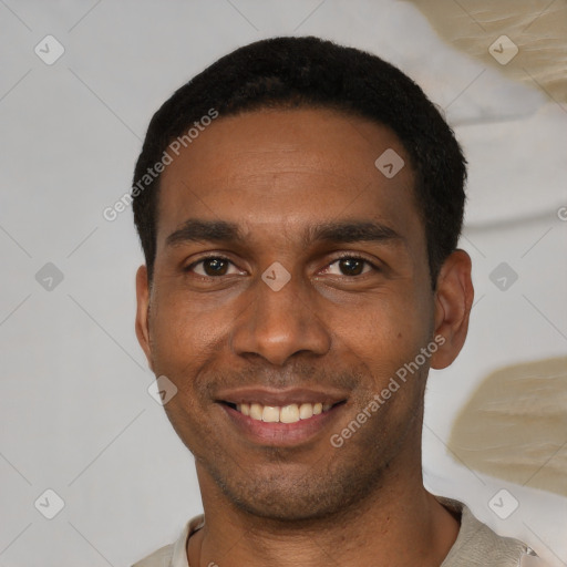 Joyful black young-adult male with short  black hair and brown eyes