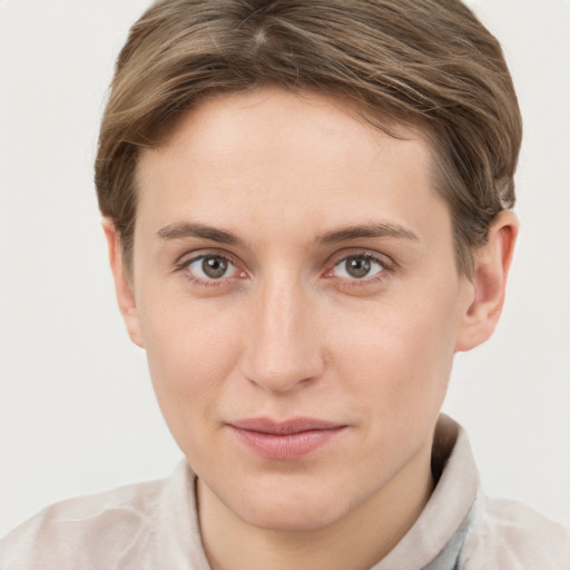 Joyful white young-adult female with short  brown hair and grey eyes