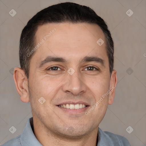 Joyful white adult male with short  brown hair and brown eyes