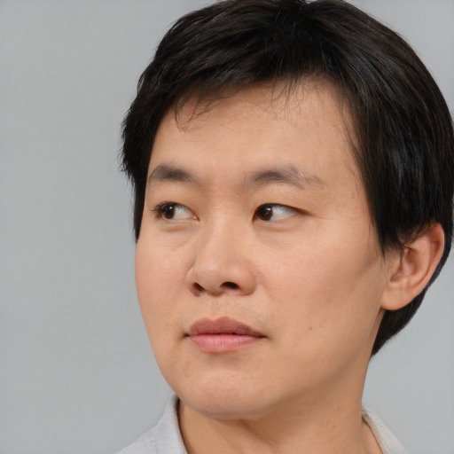 Neutral asian young-adult male with short  brown hair and brown eyes