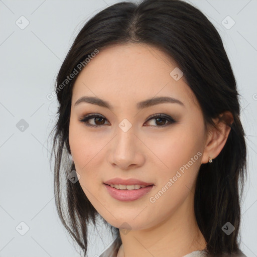 Joyful asian young-adult female with long  brown hair and brown eyes