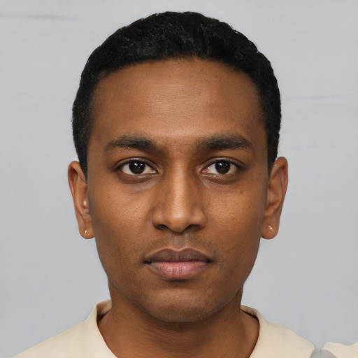 Neutral latino young-adult male with short  black hair and brown eyes