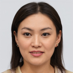 Joyful asian young-adult female with medium  brown hair and brown eyes