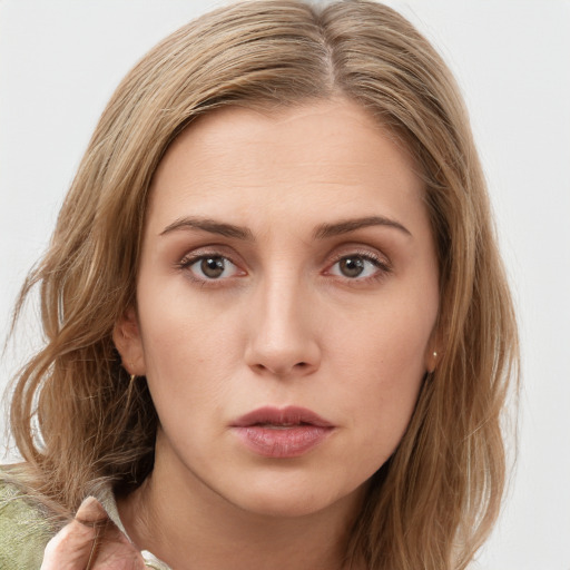 Neutral white young-adult female with long  brown hair and brown eyes