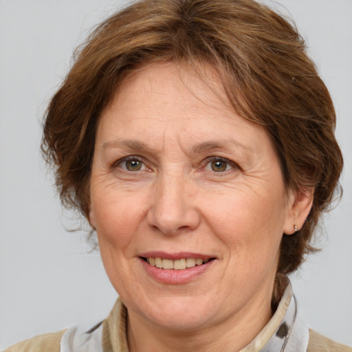 Joyful white middle-aged female with medium  brown hair and brown eyes