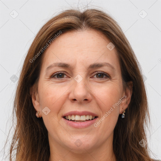 Joyful white adult female with long  brown hair and brown eyes