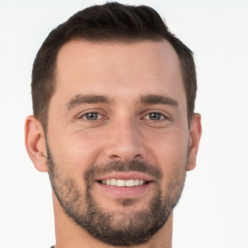 Joyful white young-adult male with short  brown hair and brown eyes