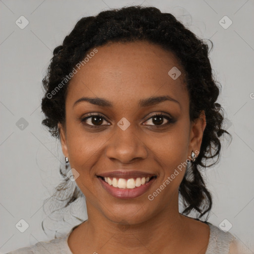 Joyful black young-adult female with medium  black hair and brown eyes