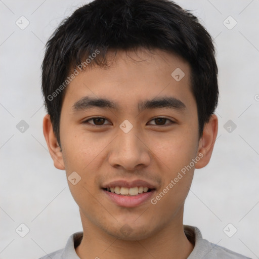 Joyful asian young-adult male with short  brown hair and brown eyes