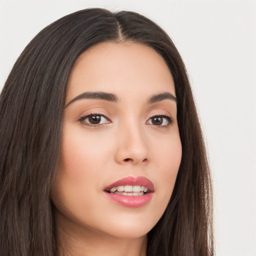 Joyful asian young-adult female with long  brown hair and brown eyes