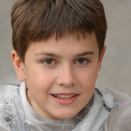 Joyful white child male with short  brown hair and brown eyes