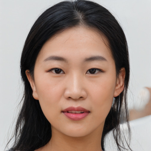 Joyful asian young-adult female with medium  black hair and brown eyes