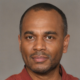 Neutral latino adult male with short  black hair and brown eyes