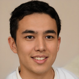 Joyful latino young-adult male with short  brown hair and brown eyes