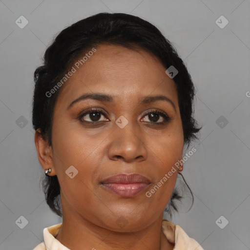 Joyful black adult female with medium  brown hair and brown eyes