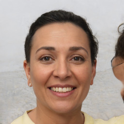 Joyful white adult female with short  brown hair and brown eyes