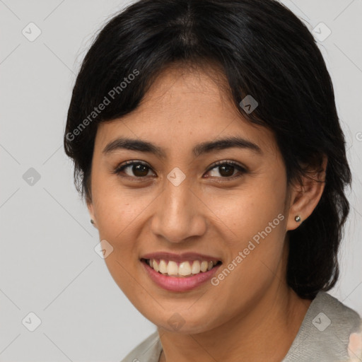 Joyful asian young-adult female with medium  brown hair and brown eyes