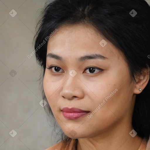 Joyful asian young-adult female with long  brown hair and brown eyes