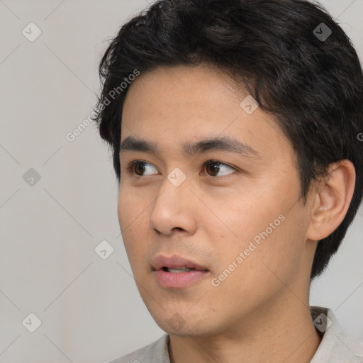 Neutral white young-adult male with short  black hair and brown eyes