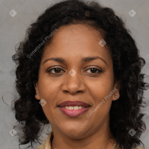 Joyful black adult female with medium  brown hair and brown eyes