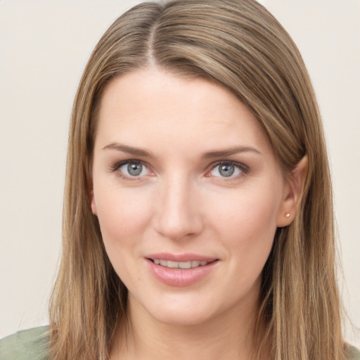 Joyful white young-adult female with long  brown hair and grey eyes