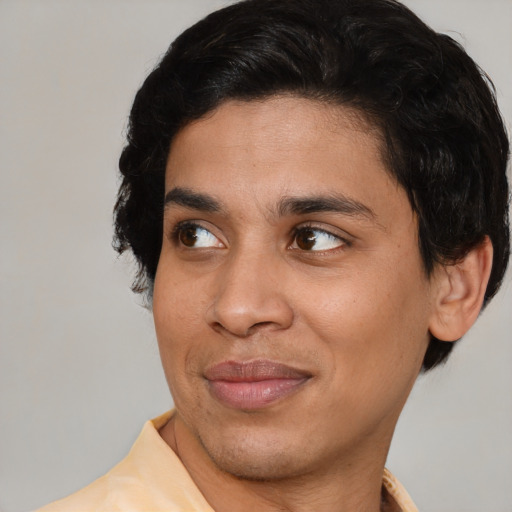 Joyful white young-adult male with medium  brown hair and brown eyes