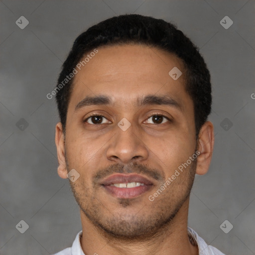 Joyful latino young-adult male with short  black hair and brown eyes