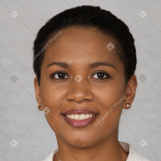 Joyful black young-adult female with short  black hair and brown eyes