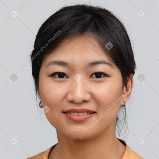 Joyful asian young-adult female with medium  brown hair and brown eyes