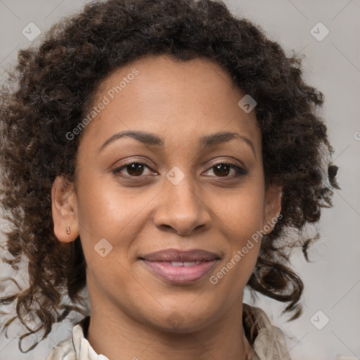 Joyful black adult female with medium  brown hair and brown eyes