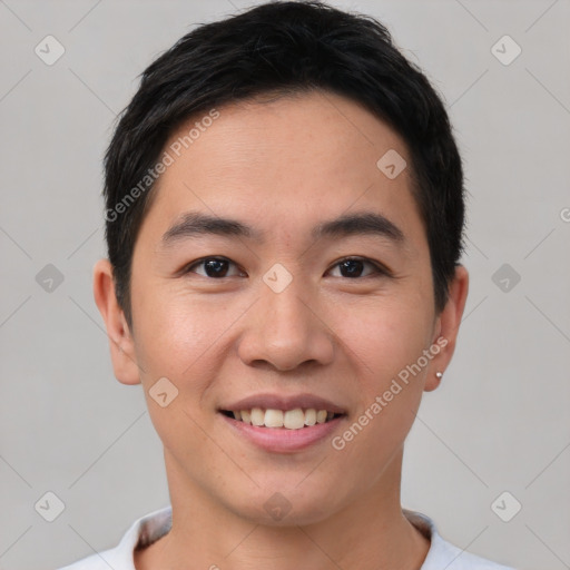 Joyful asian young-adult male with short  brown hair and brown eyes