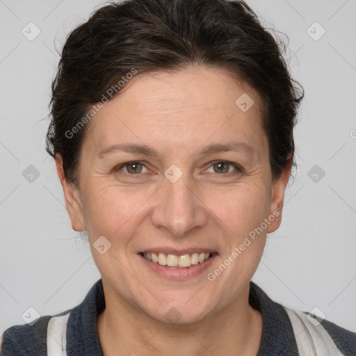 Joyful white adult female with short  brown hair and brown eyes