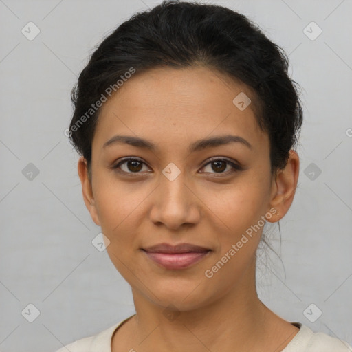 Joyful latino young-adult female with short  brown hair and brown eyes