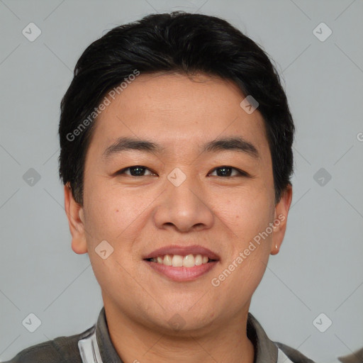 Joyful asian young-adult male with short  black hair and brown eyes